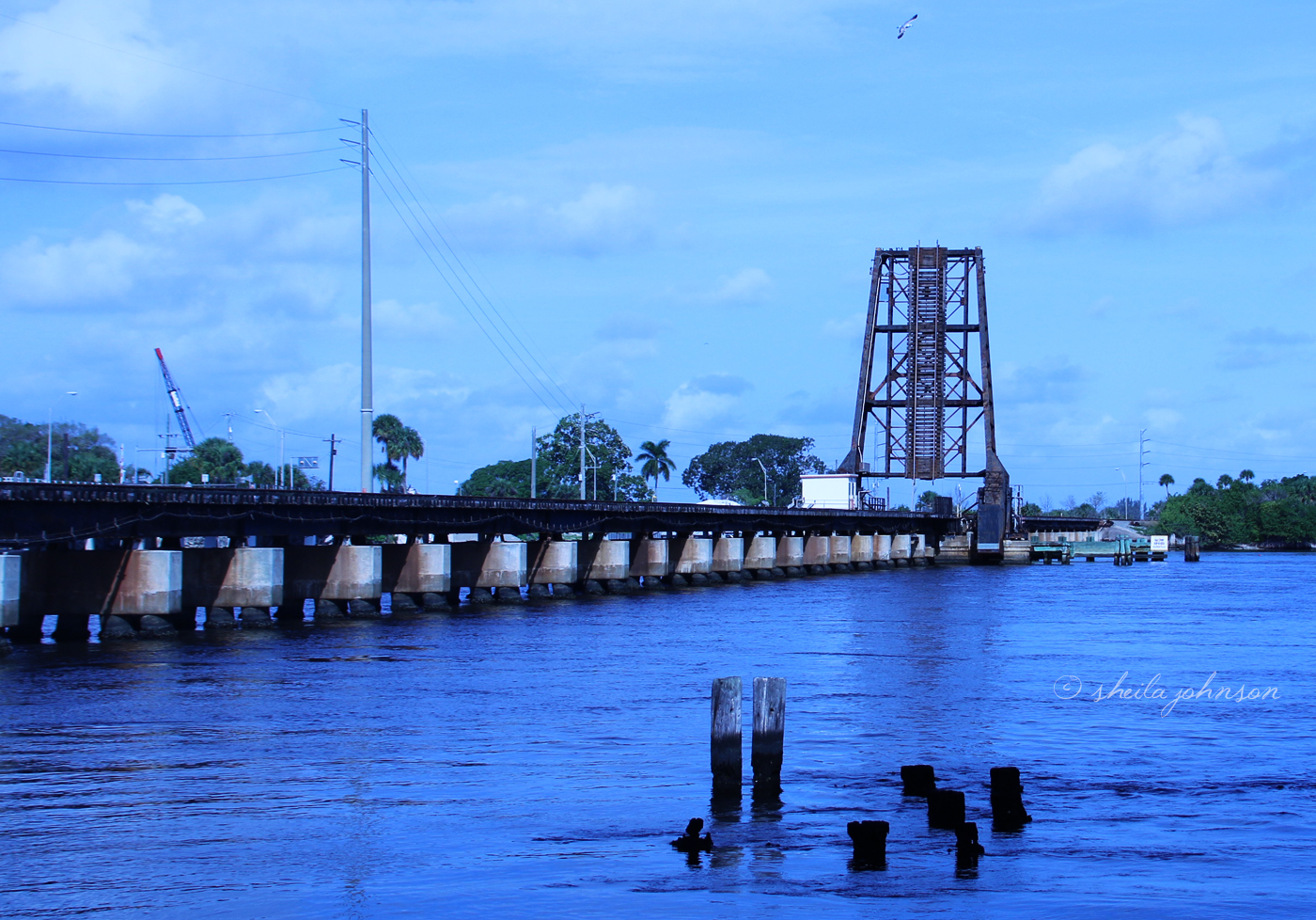 The Train Bridge Over The St. Lucie River, Downtown Stuart, Florida, Is A Blue Vision At Dusk.